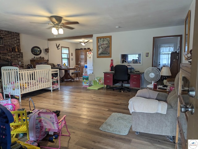 418 W Gravel St, Clinton, MO 64735 - bedroom featuring wood finished floors, a ceiling fan, and freestanding refrigerator