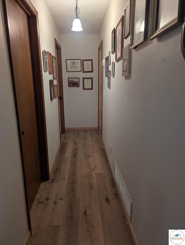 418 W Gravel St, Clinton, MO 64735 - hallway with visible vents and light wood-type flooring