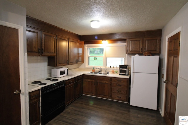 101 Lakeveiw Dr, Windsor, MO 65360 - kitchen featuring white appliances, a sink, light countertops, dark wood-type flooring, and a textured ceiling