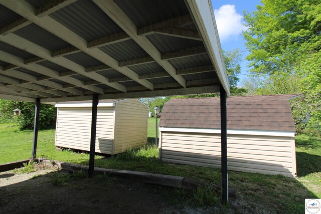 101 Lakeveiw Dr, Windsor, MO 65360 - view of parking with a storage unit