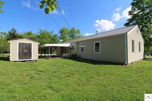 101 Lakeveiw Dr, Windsor, MO 65360 - view of grassy yard with central AC unit
