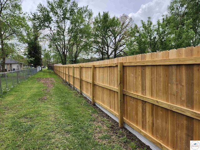 view of yard with a fenced backyard