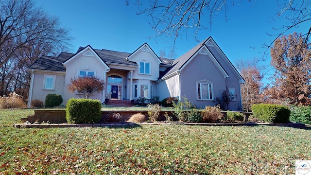 1519 Cobblestone Dr, Sedalia, MO 65301 - traditional-style home featuring stucco siding and a front yard