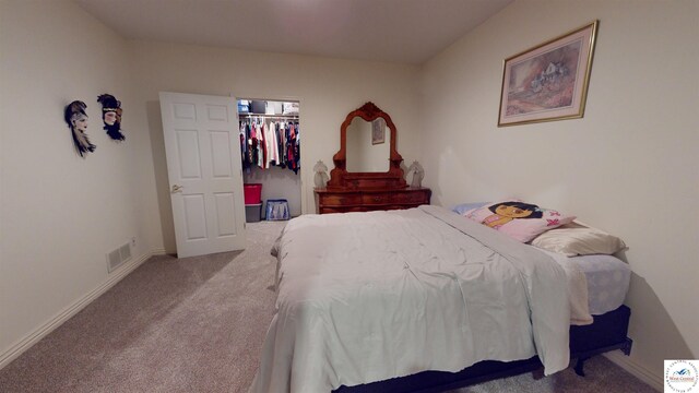 1519 Cobblestone Dr, Sedalia, MO 65301 - bedroom with visible vents, a spacious closet, baseboards, and carpet floors