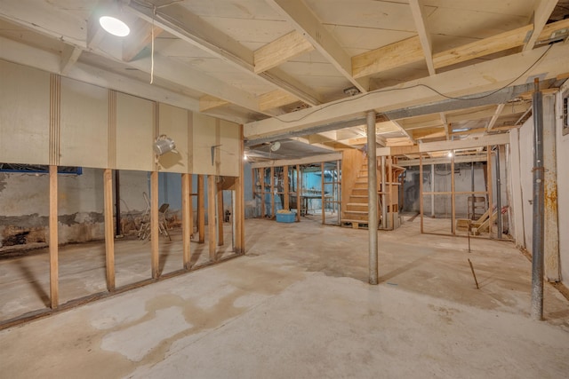 245 Randolph St, Tipton, MO 65081 - unfinished below grade area featuring stairway