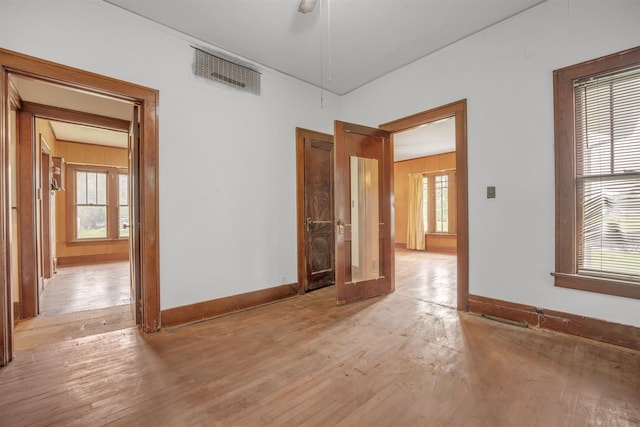 245 Randolph St, Tipton, MO 65081 - unfurnished room with visible vents, baseboards, and light wood-style floors
