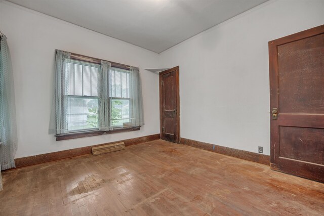 245 Randolph St, Tipton, MO 65081 - unfurnished room with hardwood / wood-style flooring and baseboards