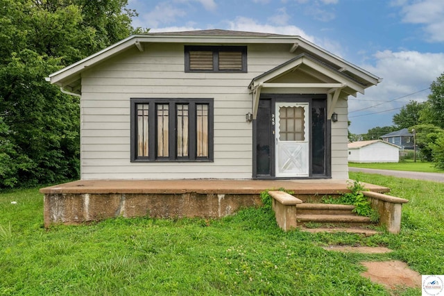245 Randolph St, Tipton, MO 65081 - view of front of property featuring a front lawn