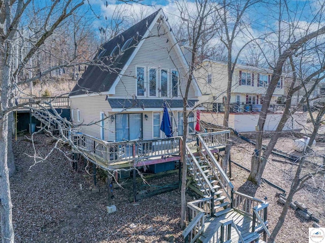 28801 Herbs Rd, Lincoln, MO 65338 - back of house with stairway, a wooden deck, and roof with shingles