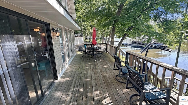 28801 Herbs Rd, Lincoln, MO 65338 - wooden terrace with a water view and outdoor dining area