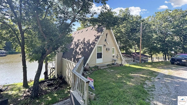 28801 Herbs Rd, Lincoln, MO 65338 - a-frame home with entry steps, roof with shingles, a water view, and a front yard