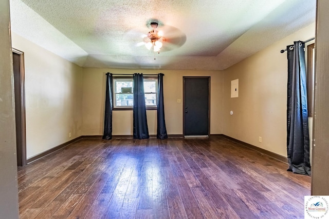 806 E Green St, Clinton, MO 64735 - unfurnished room featuring hardwood / wood-style floors, ceiling fan, baseboards, and a textured ceiling