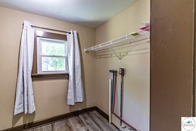 806 E Green St, Clinton, MO 64735 - washroom featuring wood finished floors and baseboards