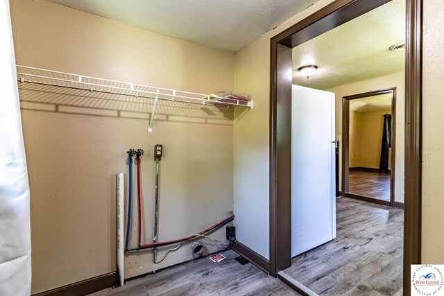 806 E Green St, Clinton, MO 64735 - washroom with wood finished floors and baseboards
