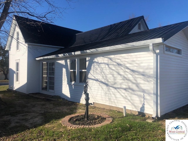 202 N Maple St, Stover, MO 65078 - view of side of property featuring metal roof