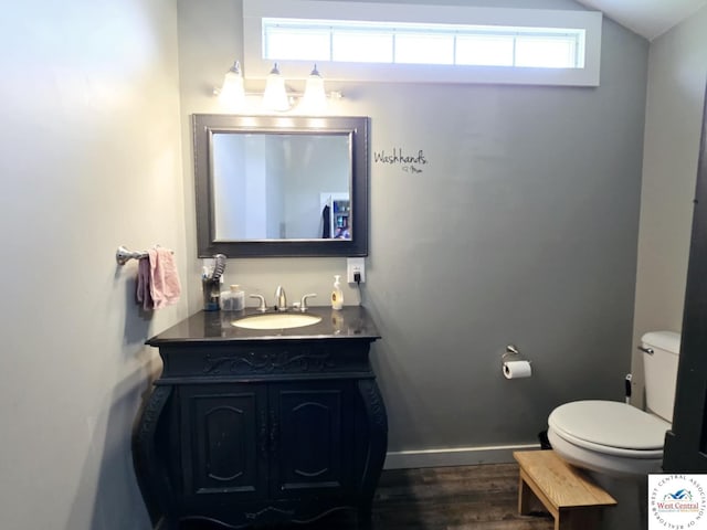 202 N Maple St, Stover, MO 65078 - bathroom featuring vanity, wood finished floors, and baseboards