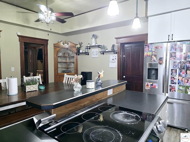 202 N Maple St, Stover, MO 65078 - kitchen featuring appliances with stainless steel finishes, a ceiling fan, white cabinetry, light wood-type flooring, and hanging light fixtures