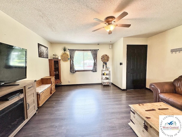 2704 Rosebud Cir, Sedalia, MO 65301 - living area featuring dark wood finished floors, a ceiling fan, and a textured ceiling