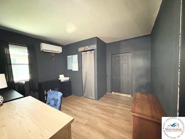 2704 Rosebud Cir, Sedalia, MO 65301 - office space featuring a wall unit AC and light wood-style flooring