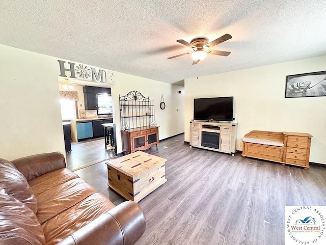 2704 Rosebud Cir, Sedalia, MO 65301 - living area featuring ceiling fan, a textured ceiling, and wood finished floors