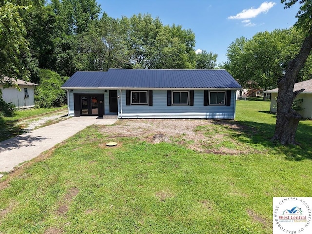 2704 Rosebud Cir, Sedalia, MO 65301 - ranch-style house with a metal roof, a front yard, and concrete driveway