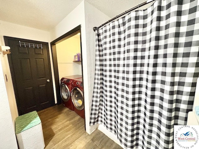 2704 Rosebud Cir, Sedalia, MO 65301 - washroom with a textured ceiling, wood finished floors, washer / clothes dryer, and a textured wall