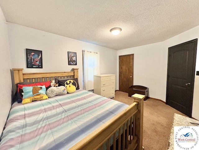 2704 Rosebud Cir, Sedalia, MO 65301 - bedroom featuring light colored carpet and a textured ceiling