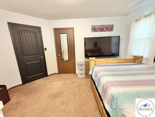 2704 Rosebud Cir, Sedalia, MO 65301 - bedroom featuring light carpet and a textured ceiling