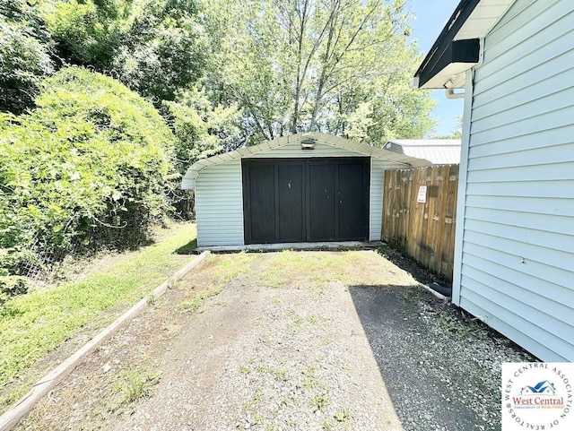 2704 Rosebud Cir, Sedalia, MO 65301 - garage with a storage shed and dirt driveway