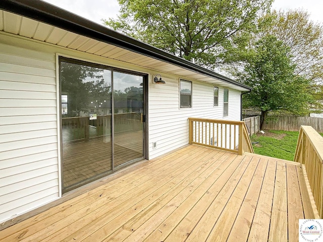 wooden deck featuring fence