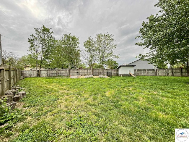 view of yard with a fenced backyard