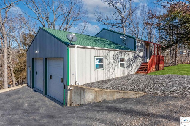 25939 Old Oar House Rd, Warsaw, MO 65355 - view of home's exterior featuring a metal roof and a detached garage