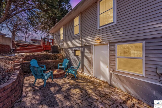 25939 Old Oar House Rd, Warsaw, MO 65355 - patio terrace at dusk with an outdoor fire pit and a patio area