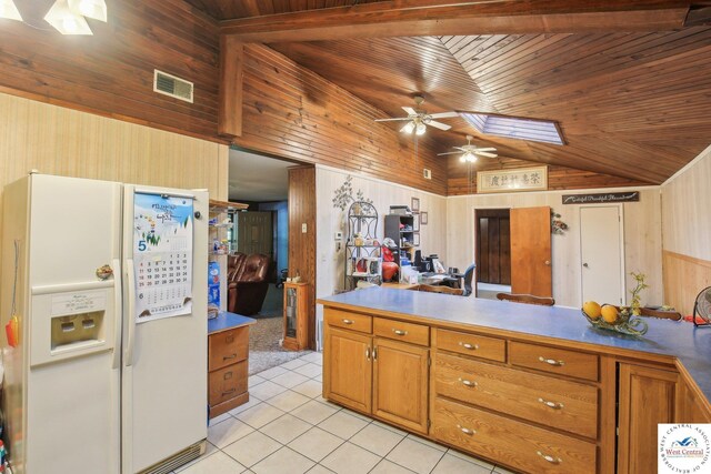 828 SE 601st Rd, Leeton, MO 64761 - kitchen with white fridge with ice dispenser, wood ceiling, vaulted ceiling, ceiling fan, and light tile patterned flooring