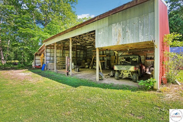 828 SE 601st Rd, Leeton, MO 64761 - view of pole building featuring a yard and a carport