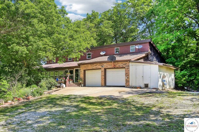 828 SE 601st Rd, Leeton, MO 64761 - view of front facade featuring driveway and covered porch