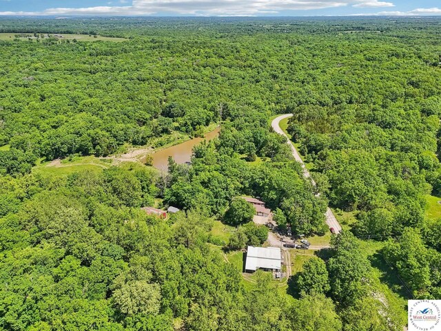 828 SE 601st Rd, Leeton, MO 64761 - aerial view of property's location featuring a forest