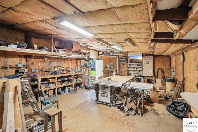 828 SE 601st Rd, Leeton, MO 64761 - basement featuring a workshop area and wood finished floors