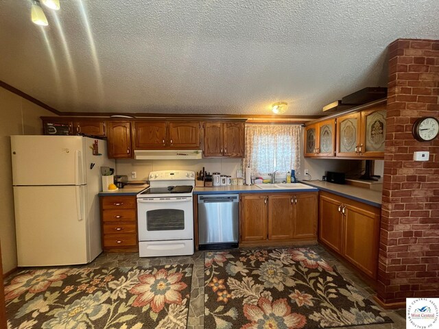 31674 Aspen Rd, Stover, MO 65078 - kitchen with white appliances, under cabinet range hood, a textured ceiling, glass insert cabinets, and brown cabinetry