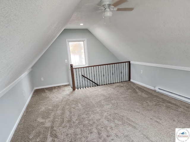 10075 Otter Rd, Clinton, MO 64735 - bonus room with a ceiling fan, carpet, lofted ceiling, baseboard heating, and baseboards