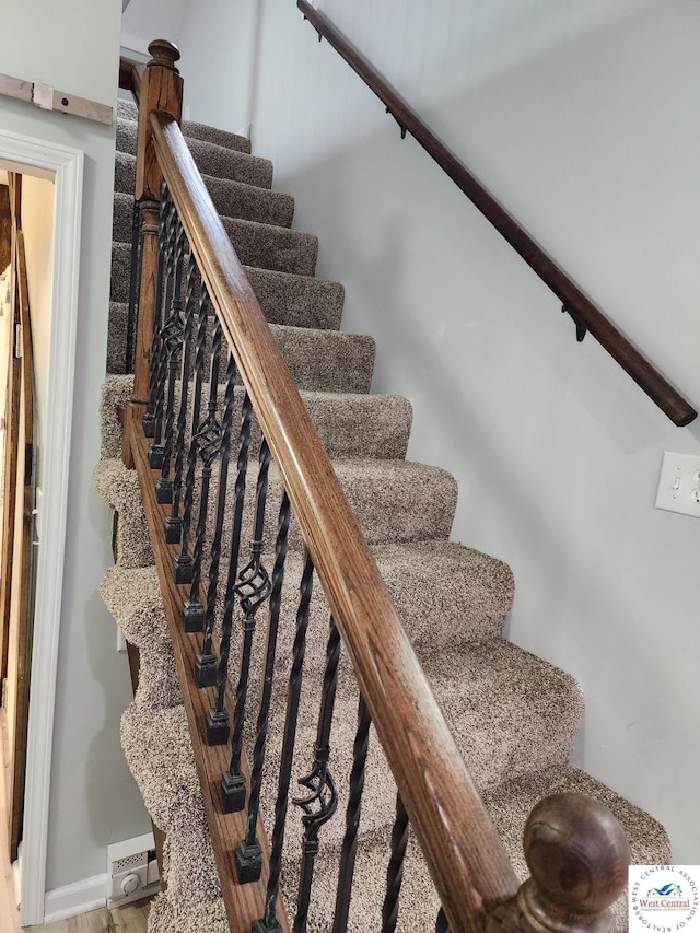 10075 Otter Rd, Clinton, MO 64735 - stairs featuring wood finished floors