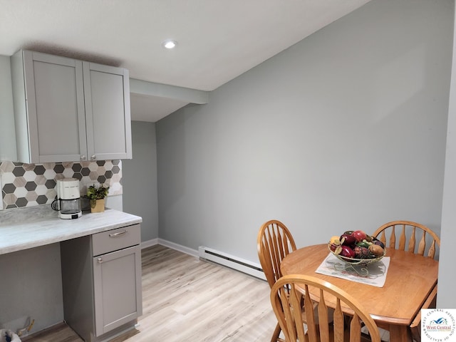 10075 Otter Rd, Clinton, MO 64735 - dining space with a baseboard heating unit, light wood-type flooring, baseboards, and recessed lighting