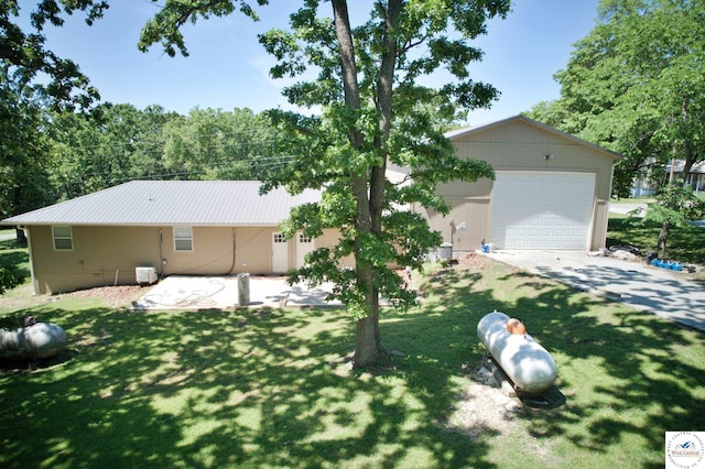 29790 Bobcat Dr, Warsaw, MO 65355 - view of front facade featuring a front lawn, driveway, and metal roof