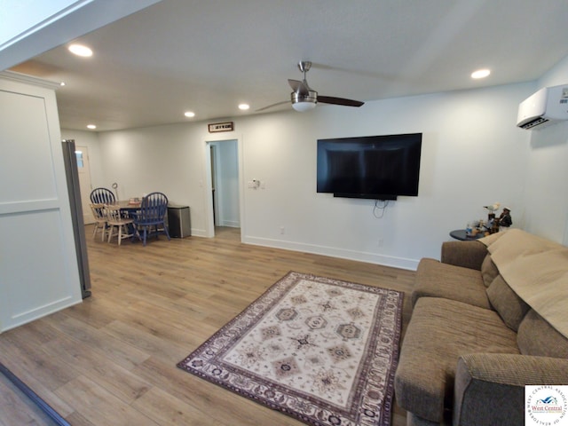 29790 Bobcat Dr, Warsaw, MO 65355 - living room featuring ceiling fan, recessed lighting, light wood-type flooring, baseboards, and an AC wall unit