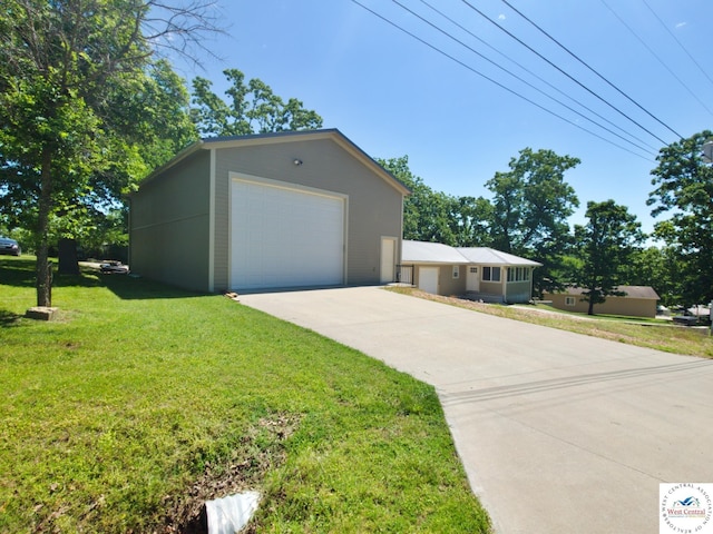 29790 Bobcat Dr, Warsaw, MO 65355 - view of front of home with a detached garage, a front yard, and concrete driveway