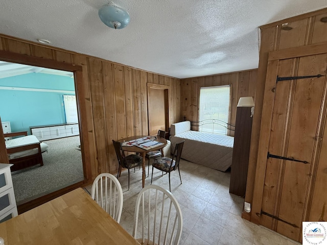 19094 Kennedy Rd, Warsaw, MO 65355 - dining space featuring wooden walls and a textured ceiling