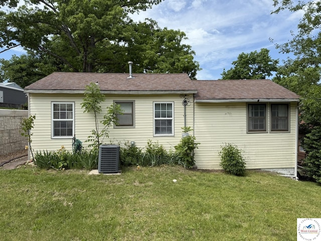 19094 Kennedy Rd, Warsaw, MO 65355 - back of house with central AC and roof with shingles