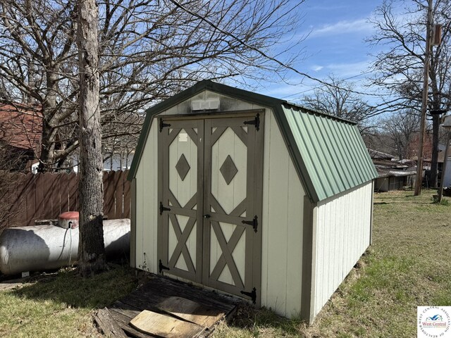 view of shed with fence