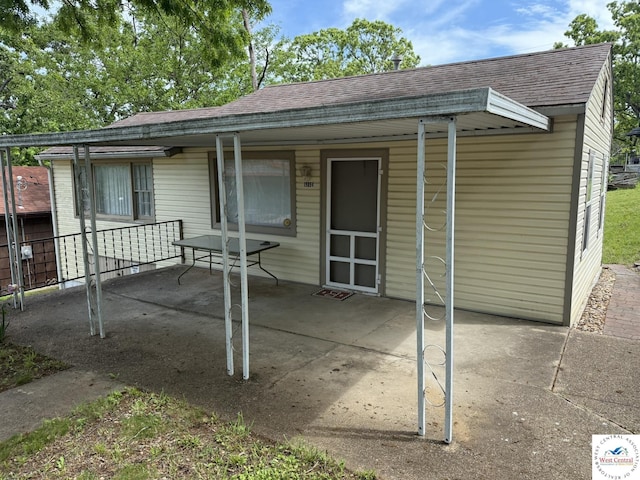 19094 Kennedy Rd, Warsaw, MO 65355 - back of property with roof with shingles and a patio