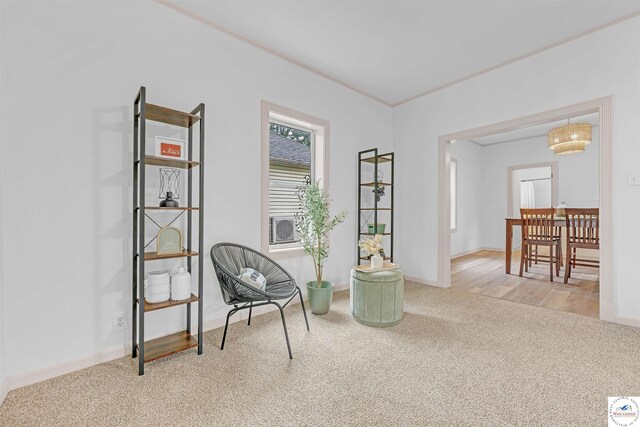 1803 S Quincy Ave, Sedalia, MO 65301 - sitting room featuring carpet flooring, baseboards, and a chandelier
